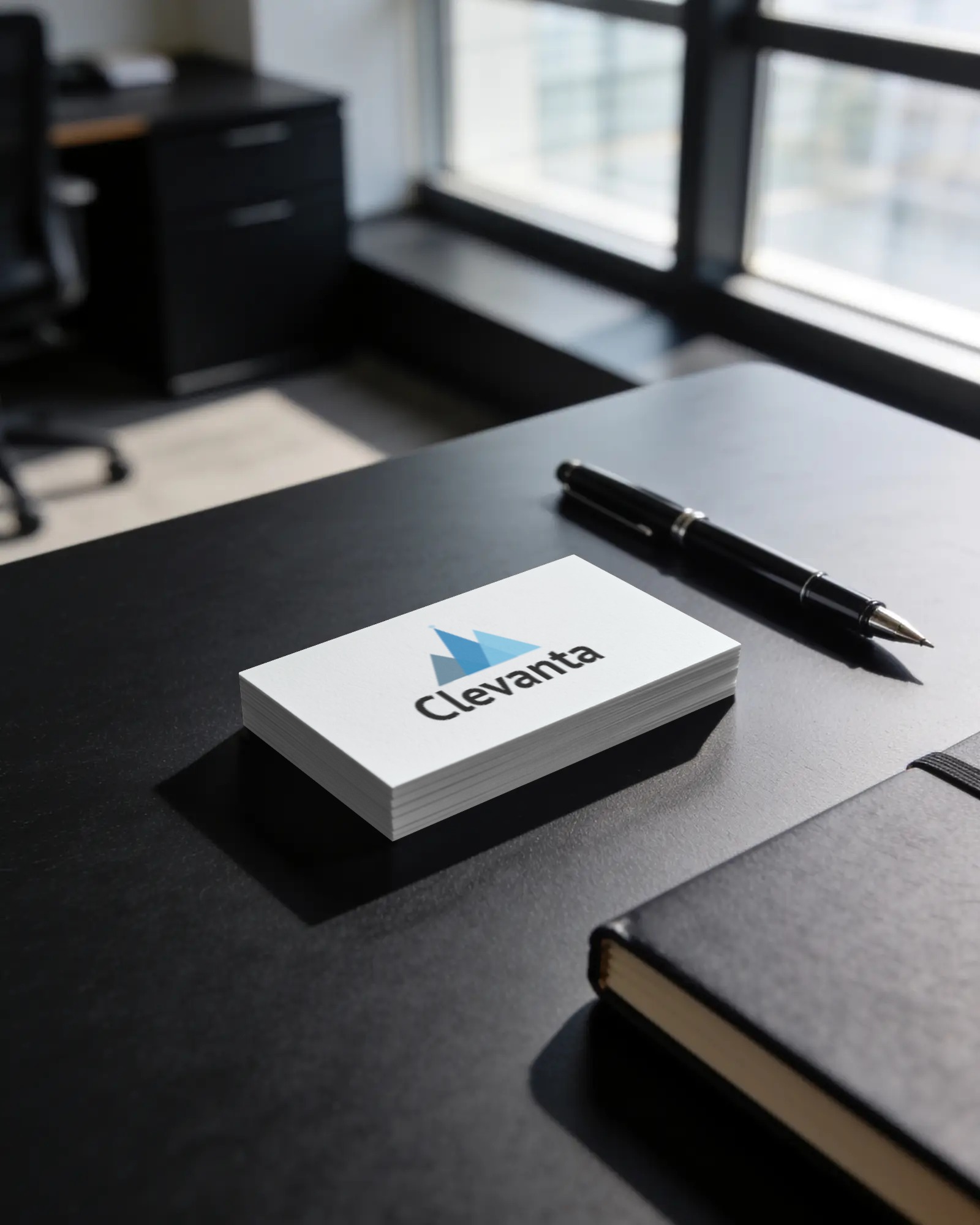 flat lay of branding materials for a tech agency, business cards, letterhead, dark mode UI on a tabl